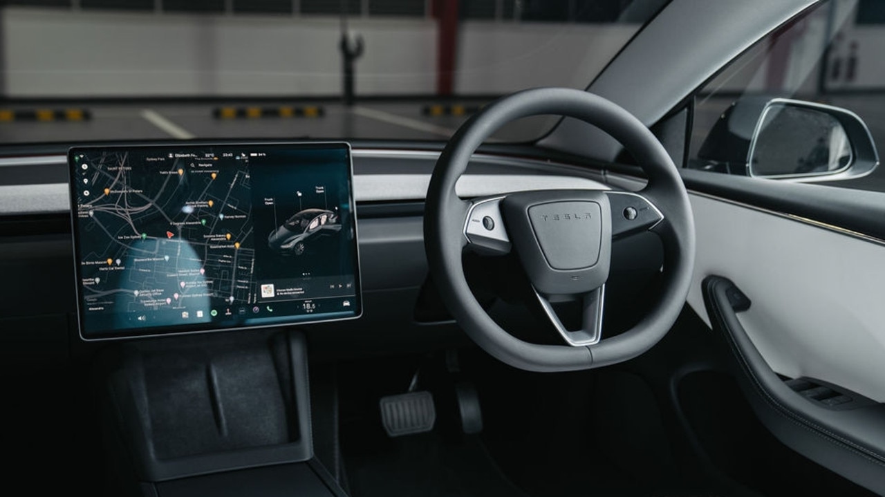 The Tesla Model 3’s touchscreen is loaded with features., Why kids hassle their parents for a Tesla, The Model 3 has the same silhouette as before, but new detailing., Tesla has revised the Model 3 electric car for 2024., Technology, Motoring, Motoring News, 2024 Tesla Model 3 first drive