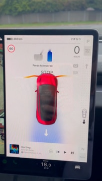 New Tesla drives by touchscreen, The Tesla Model 3’s touchscreen is loaded with features., Why kids hassle their parents for a Tesla, The Model 3 has the same silhouette as before, but new detailing., Tesla has revised the Model 3 electric car for 2024., Technology, Motoring, Motoring News, 2024 Tesla Model 3 first drive