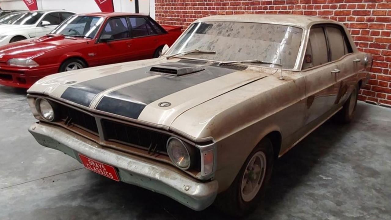 After a partial clean, it sold for $230,000. Picture: Grays., It came out covered it grime. Picture: Grays., The classic car was parked under a Queenslander for nearly 50 years. Picture: Grays., Technology, Motoring, Motoring News, ‘1-of-1’ 1970 Ford XY Falcon GT sells for staggering price